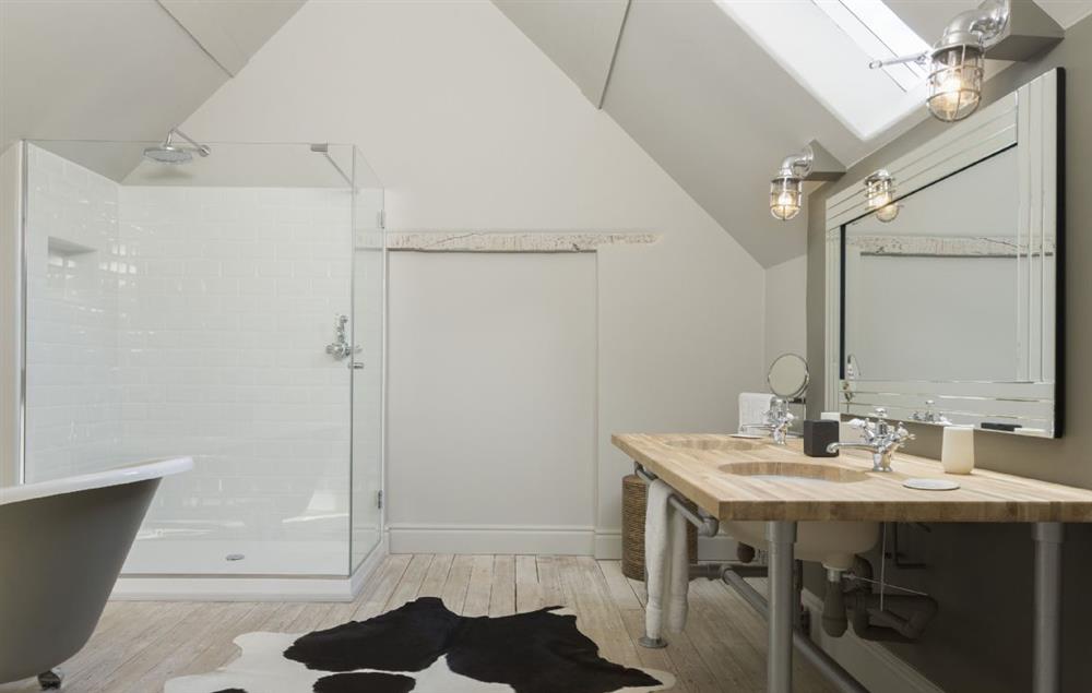 Fabulous en-suite bathroom with roll-top bath and walk in shower at The Coach House and Stables at The Lammas, Minchinhampton