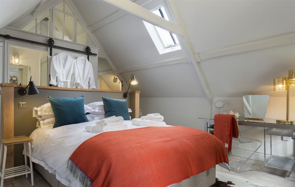 First floor Bedroom one with a king-size bed at The Coach House and Stables at The Lammas, Minchinhampton