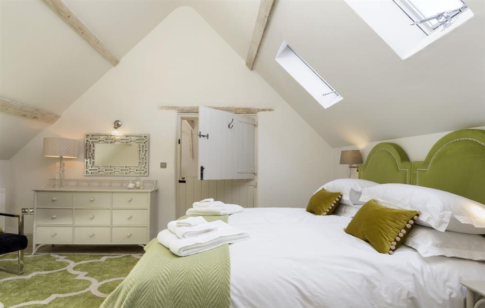 The beautifully decorated bedroom two at The Coach House and Stables at The Lammas, Minchinhampton