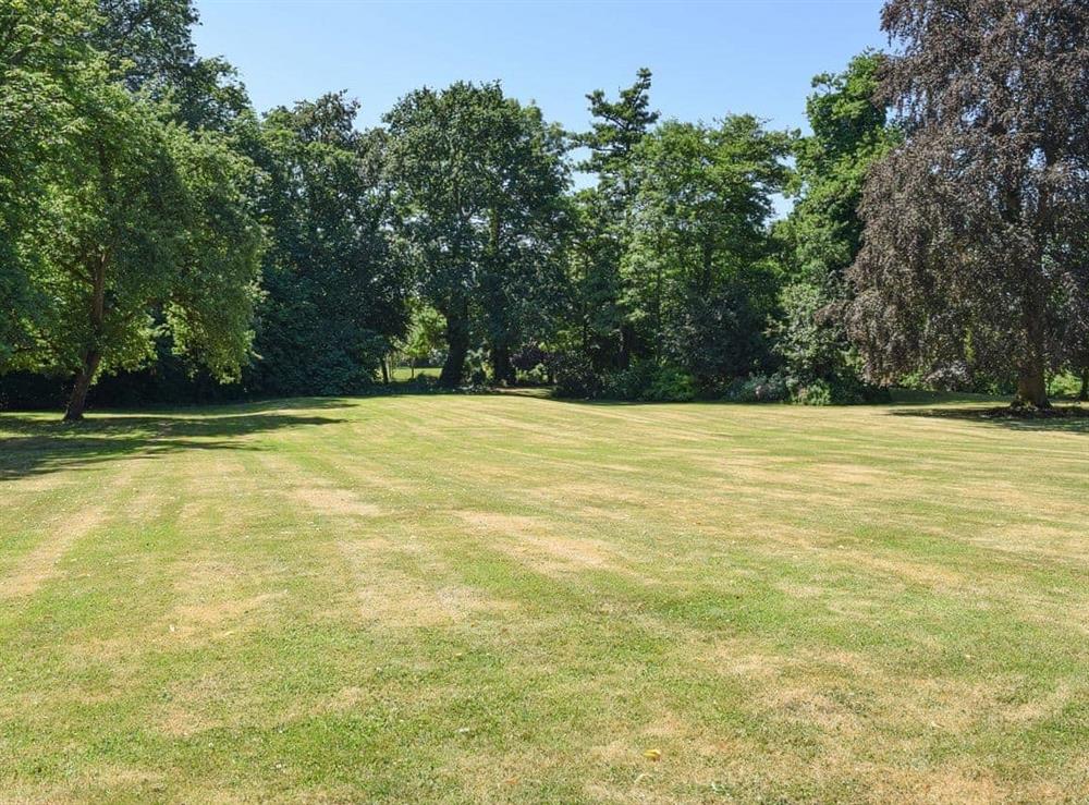 Extensive lawned gardens at The Coach House in Aston Cantlow, Nr Stratford, Warks., West Midlands