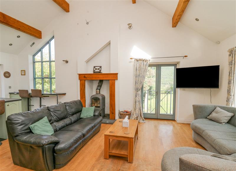 Relax in the living area at The Coach House at Plas Dolguog, Machynlleth