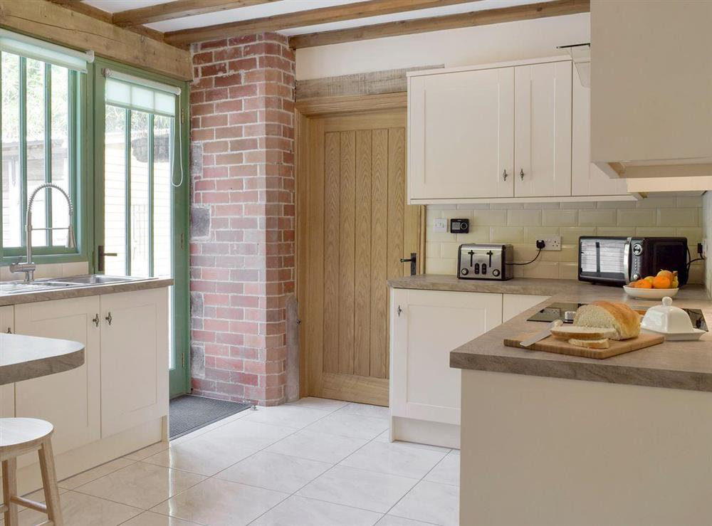 Fully-equipped fitted kitchen at The Coach House at Stable Cottage in Derwydd, near Llandeilo, Carmarthenshire, Dyfed