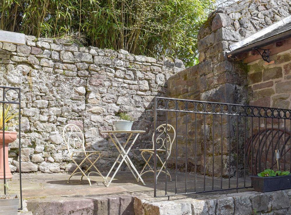 Intimate raised patio at The Coach House at Stable Cottage in Derwydd, near Llandeilo, Carmarthenshire, Dyfed