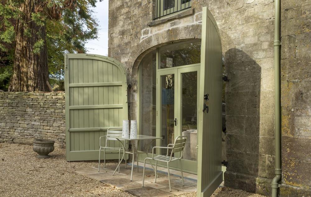 The Coach House has its own small patio area in front of the french doors leading to the sitting room