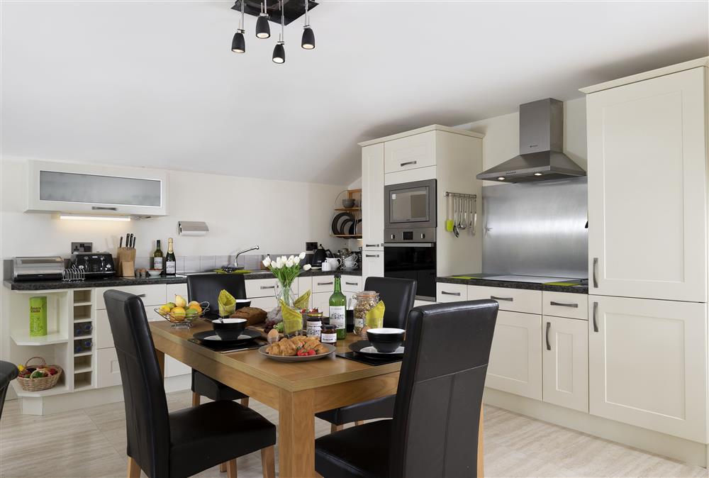 Open-plan living area with well equipped kitchen at The Coach House at The Old Rectory, Leominster