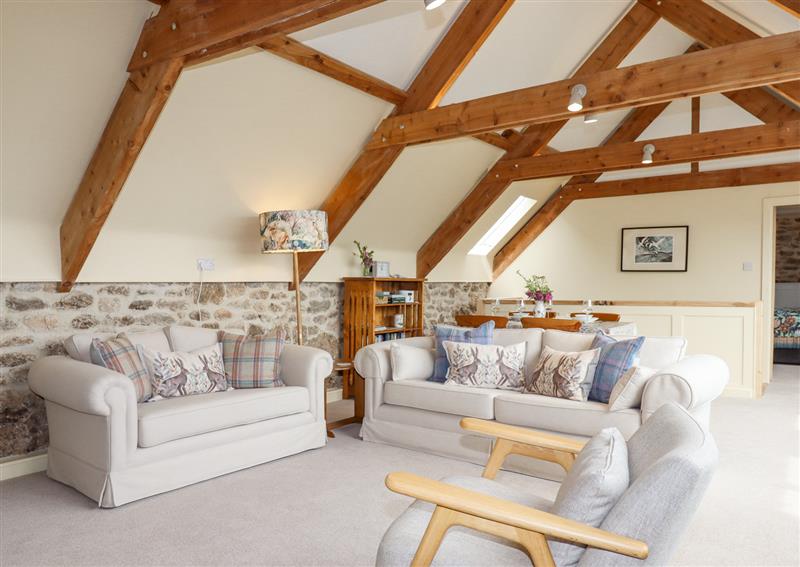 Relax in the living area at The Coach House at Thorn Farm, Bridford near Moretonhampstead