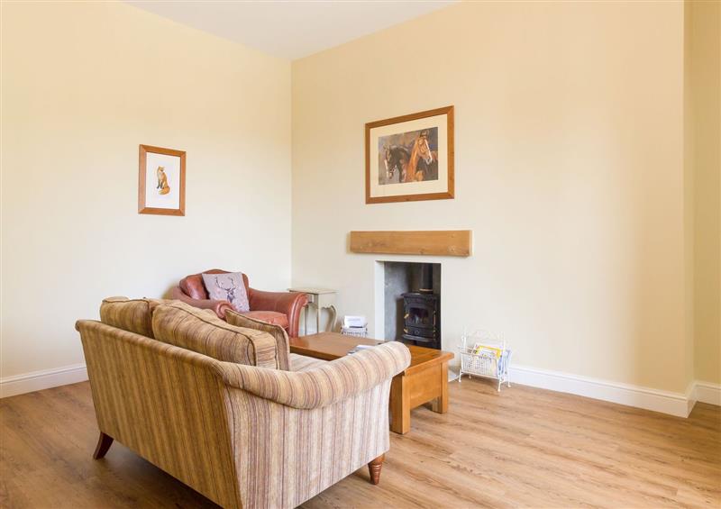 Relax in the living area at The Coach House, Belford