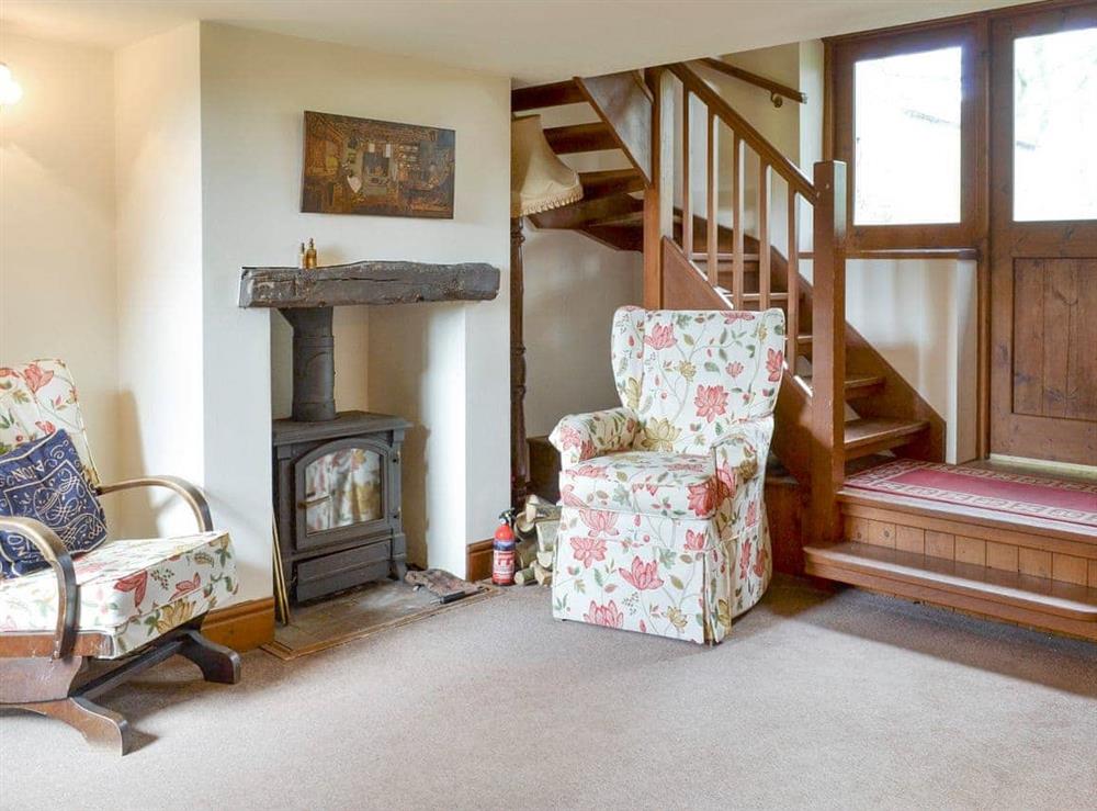 Spacious living room with wood-burner at The Coach House in Bootle, near Millom, Cumbria