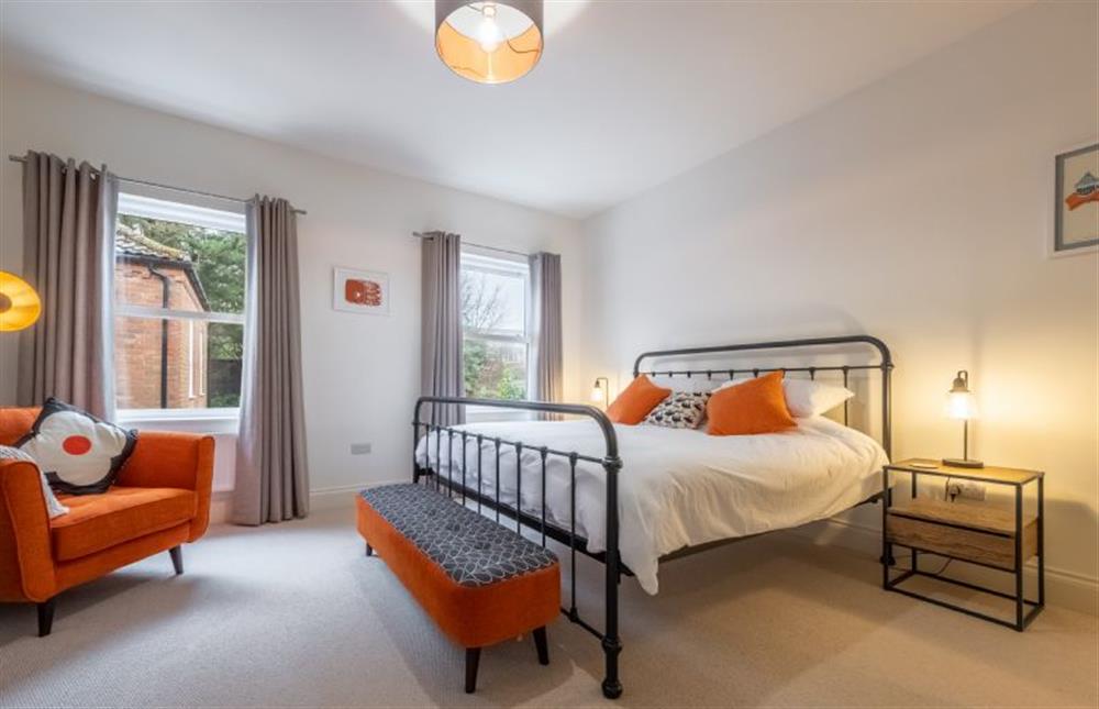 First Floor: Master bedroom with a super king sized bed  (photo 5) at The Coach House, Cromer