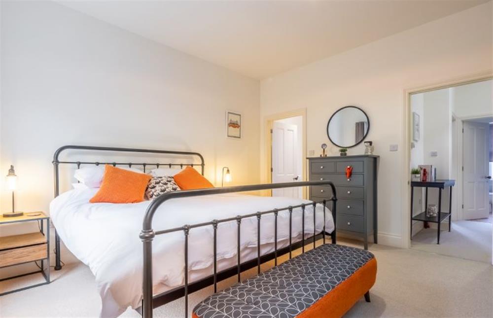 First Floor: Master bedroom with a super king sized bed  at The Coach House, Cromer
