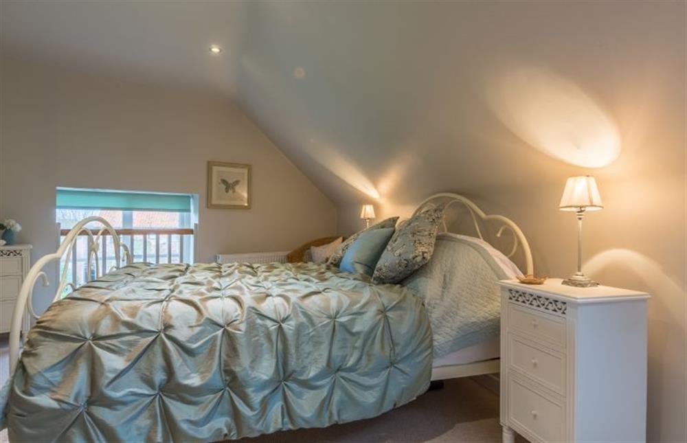 First floor: Bedroom two with King-size bed at The Coach House, Docking near Kings Lynn