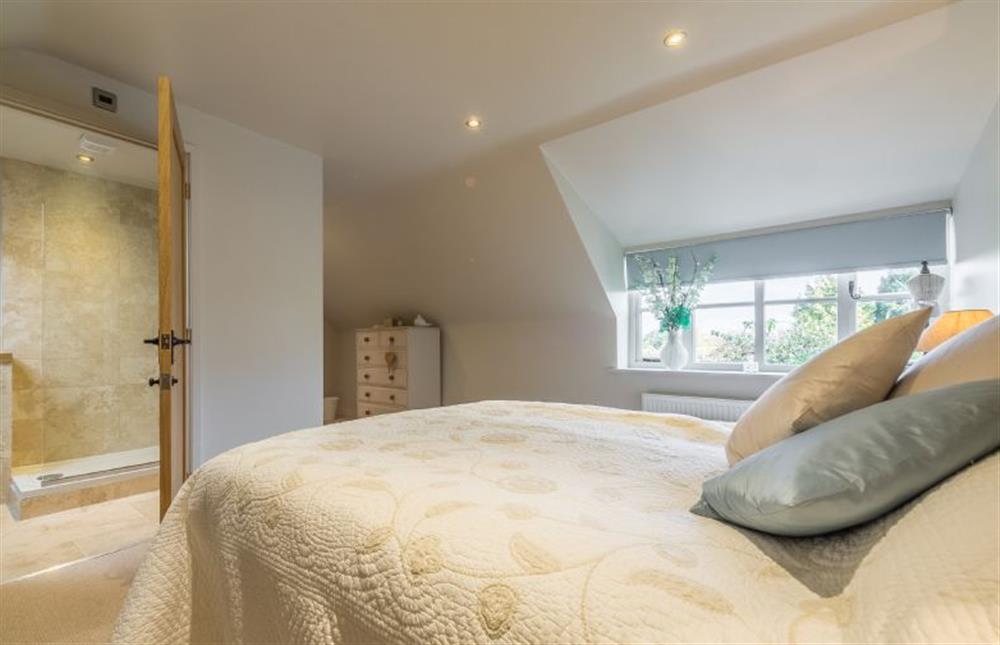 First floor: Master  bedroom with en-suite shower room at The Coach House, Docking near Kings Lynn