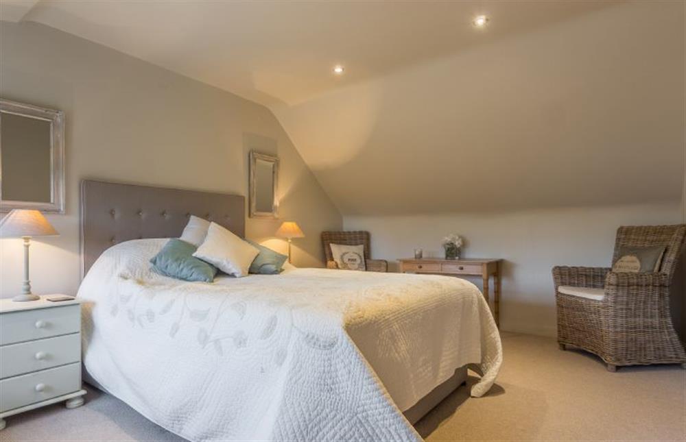 First floor: Master bedroom with King-size bed at The Coach House, Docking near Kings Lynn