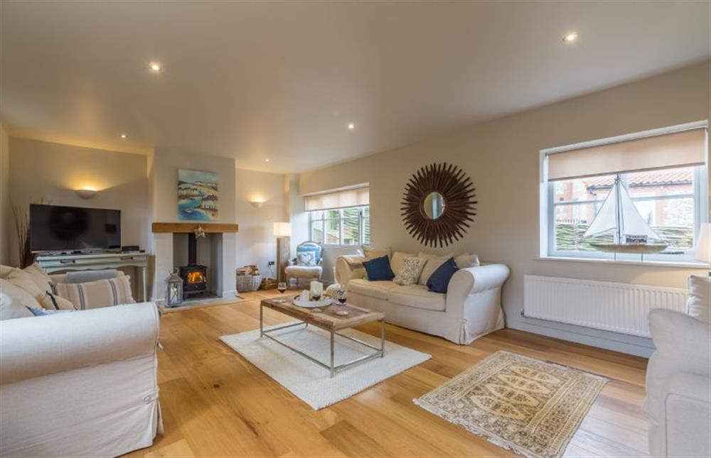 Ground floor: Sitting room with wood burning stove at The Coach House, Docking near Kings Lynn