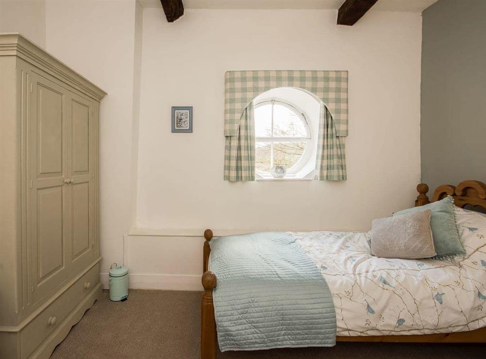 Lovely bedroom with quirky architectural features at The Coach House in Fremington, near Richmond, North Yorkshire