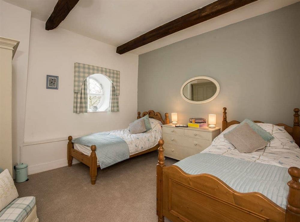 Pretty beamed twin bedroom at The Coach House in Fremington, near Richmond, North Yorkshire