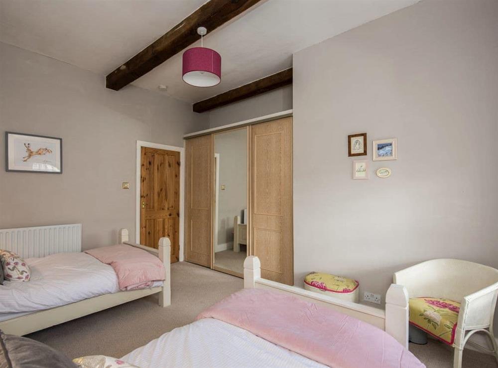 Roomy bedroom with twin single beds at The Coach House in Fremington, near Richmond, North Yorkshire