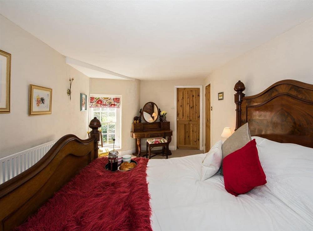 Sumptuous bedroom with kingsize bed at The Coach House in Fremington, near Richmond, North Yorkshire