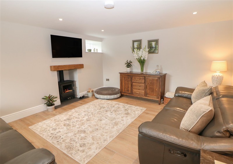 Relax in the living area at The Coach House, Holloway