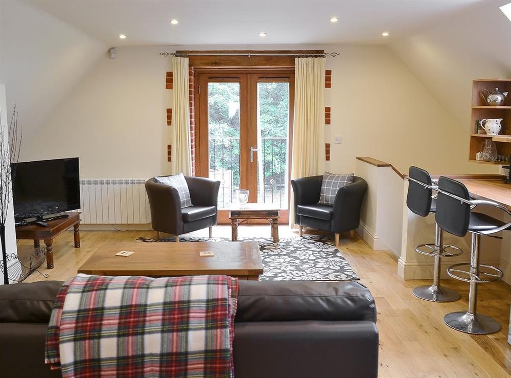 Open plan living/dining room/kitchen (photo 4) at The Coach House in Holt, Norfolk