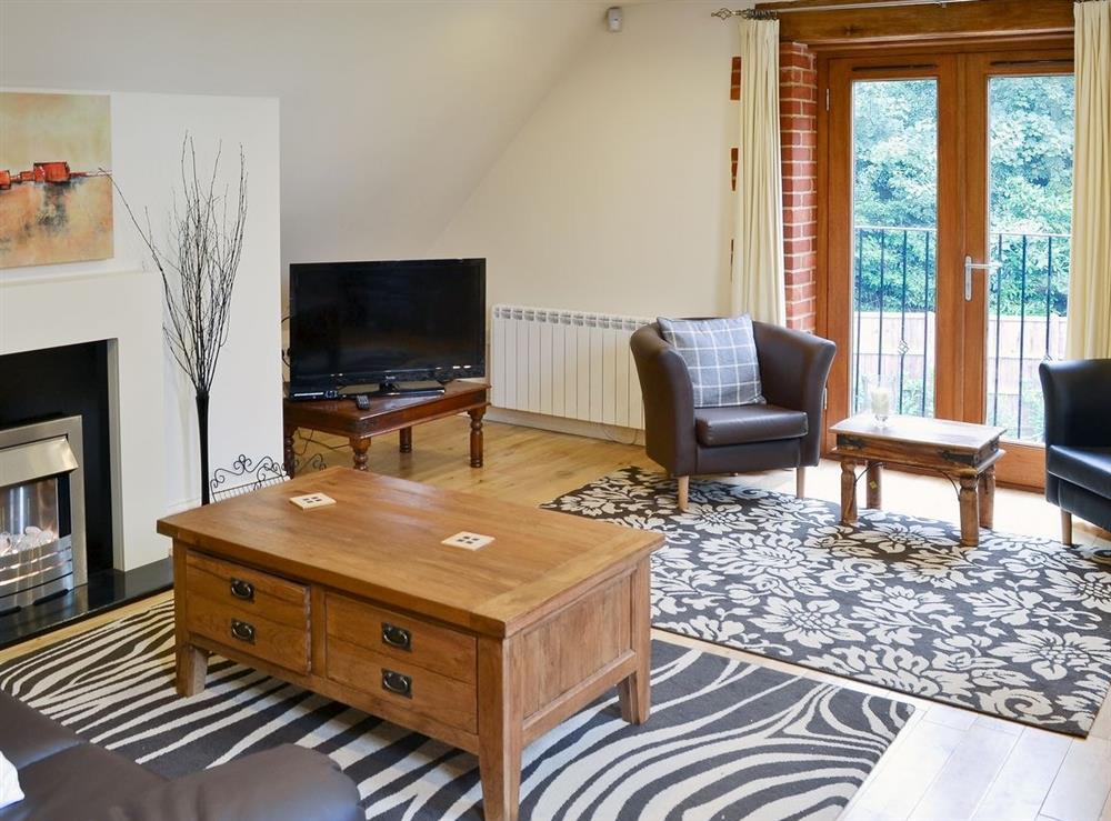 Open plan living/dining room/kitchen at The Coach House in Holt, Norfolk