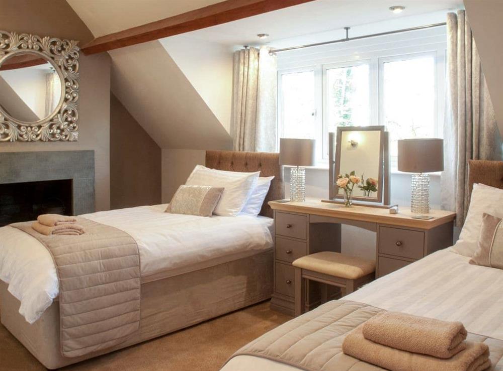Light and airy twin bedroom at The Coach House in Keswick, Cumbria