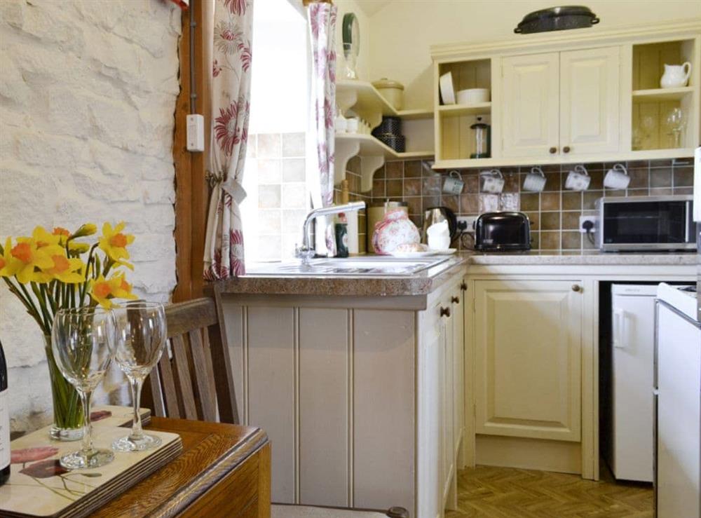 Open aspect to well-equipped kitchen at The Coach House in Kington, near Hereford, Herefordshire