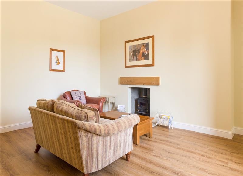 Relax in the living area at The Coach House, Middleton Hall near Belford