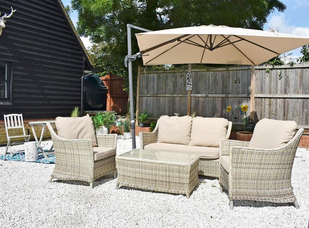 Small garden with sitting-out area at The Coach House in Peldon, near Colchester, Essex