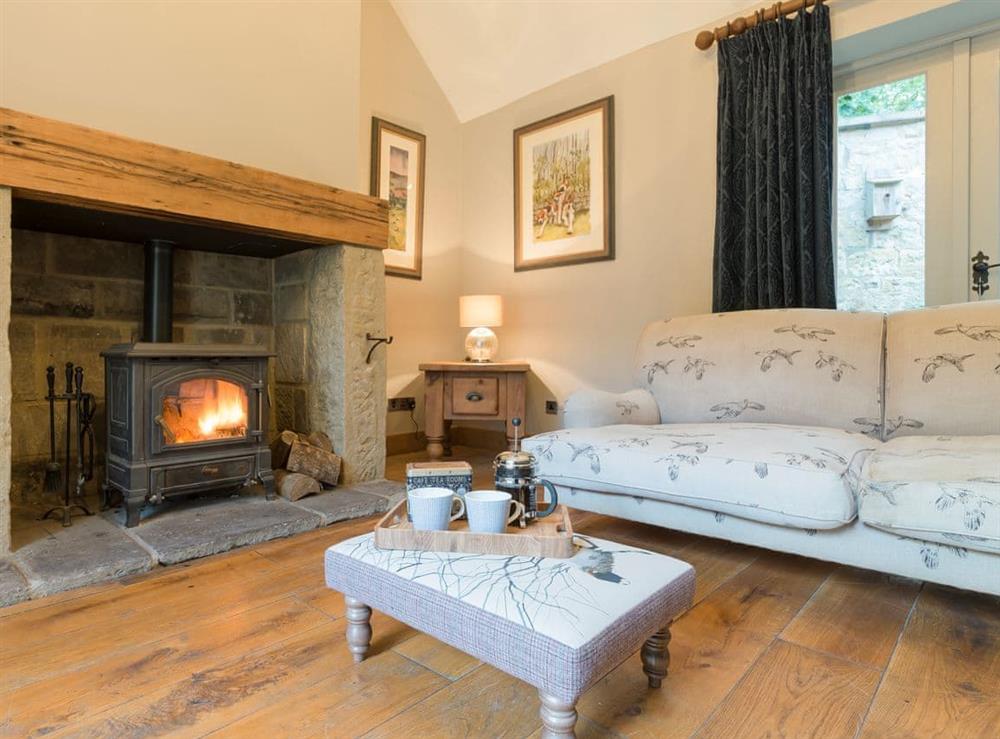 Comfy Living room with wood burner and French doors leading to garden (photo 2) at The Coach House in Riding Mill, near Corbridge, Northumberland