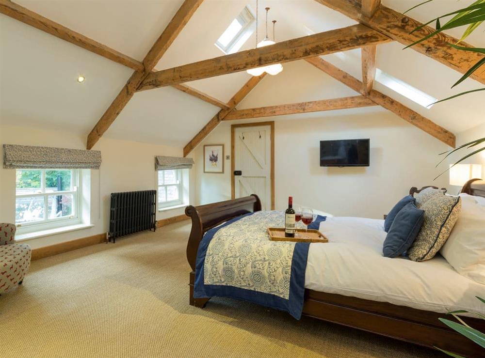 Spacious bedroom with double sleigh bed and en-suite at The Coach House in Riding Mill, near Corbridge, Northumberland