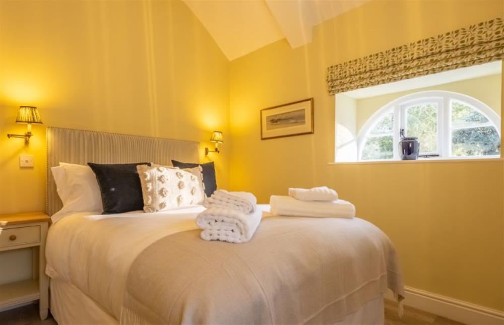 Bedroom three has a comfy king-size bed and en-suite shower room at The Coach House, Ringstead near Hunstanton