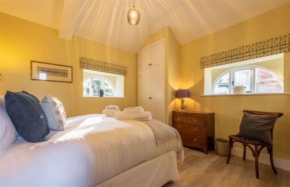 Bedroom three has a king-size bed at The Coach House, Ringstead near Hunstanton