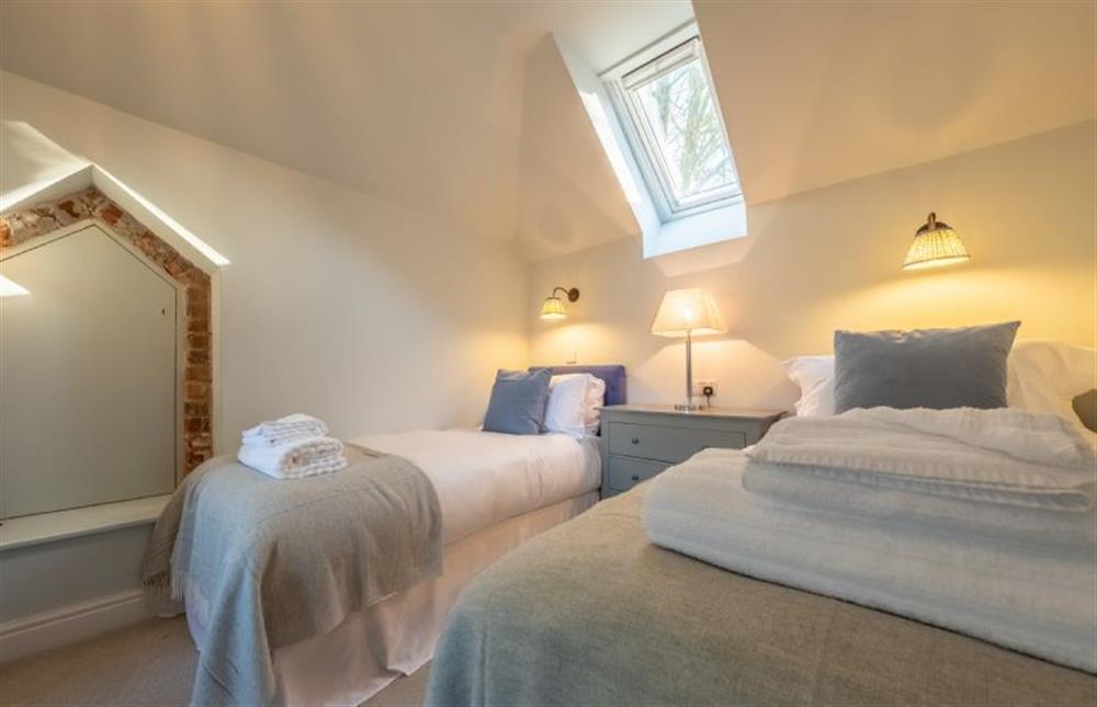 Bedroom two has full size twin beds at The Coach House, Ringstead near Hunstanton