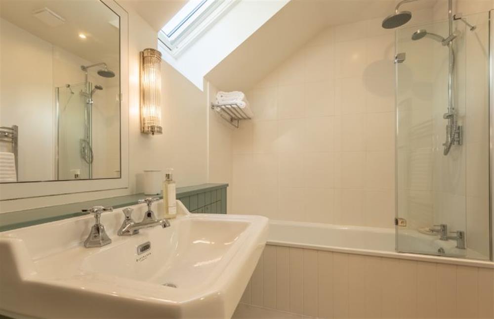 Family bathroom with bath and shower over at The Coach House, Ringstead near Hunstanton
