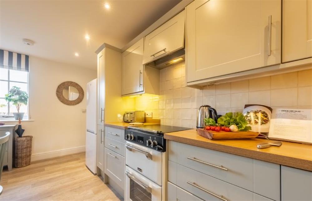 The kitchen has electric oven and induction hob at The Coach House, Ringstead near Hunstanton