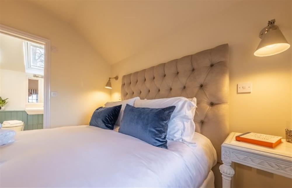 The master bedroom has an en-suite shower room at The Coach House, Ringstead near Hunstanton