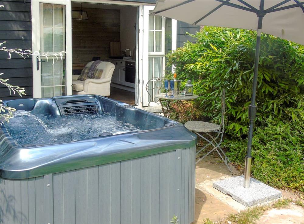 Relaxing hot tub in the garden (photo 2) at The Coach House in Saham Toney, near Watton, Norfolk