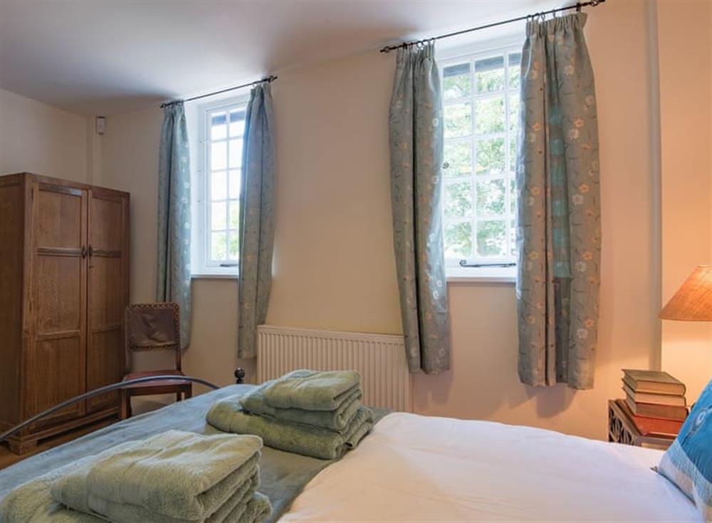Comfortable double bedroom at The Coach House Stables in Hernhill, England