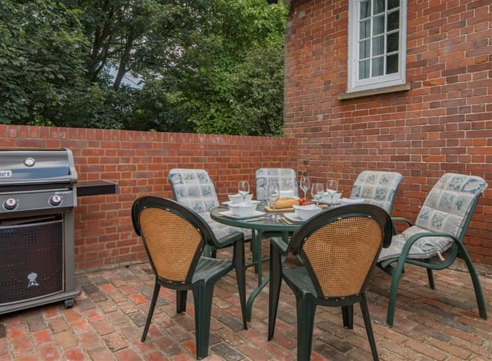 Patio and BBQ area at The Coach House Stables in Hernhill, England