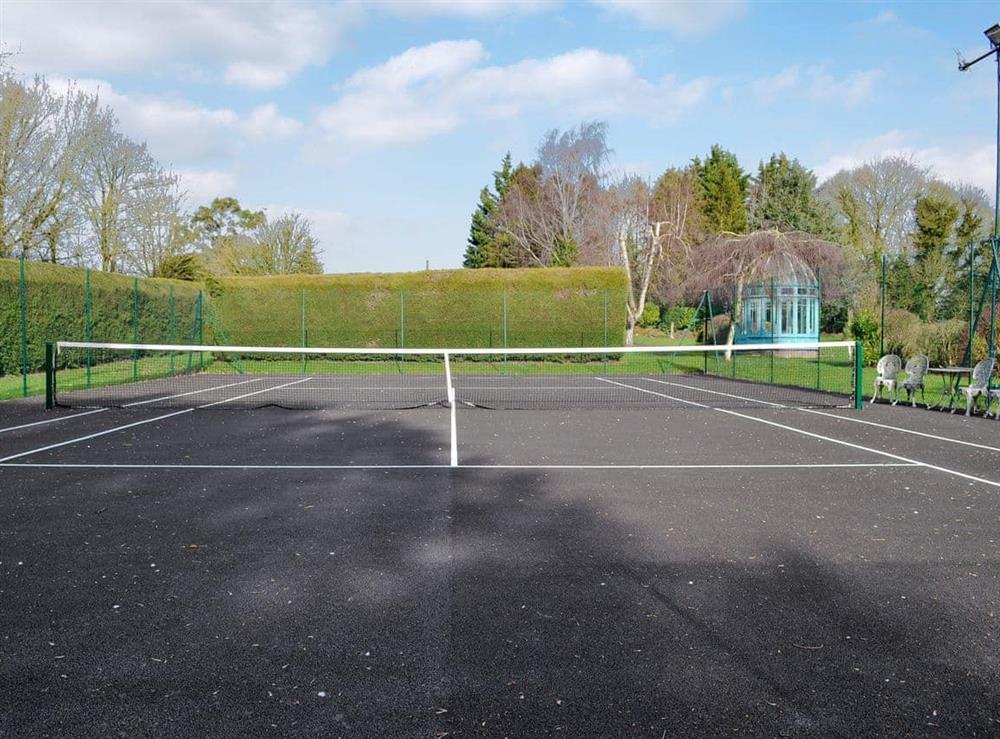 Shared tennis court at The Coach House in Tatterford Hall, Nr Fakenham., Norfolk