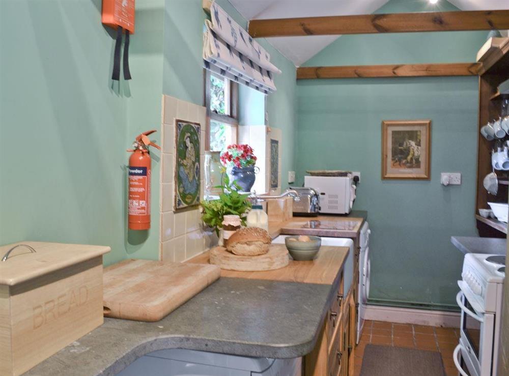 The cottage has a well equipped galley style kitchen at The Coach House in Tenbury Wells, Worcestershire