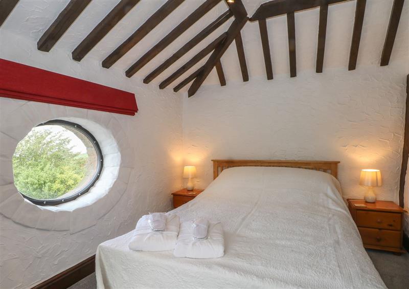This is the bedroom at The Coach House, Trelogan Hall