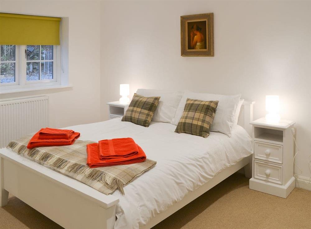 Attractive bedroom with kingsize double bed at The Coach House in White Moss, near Grasmere, Cumbria, England