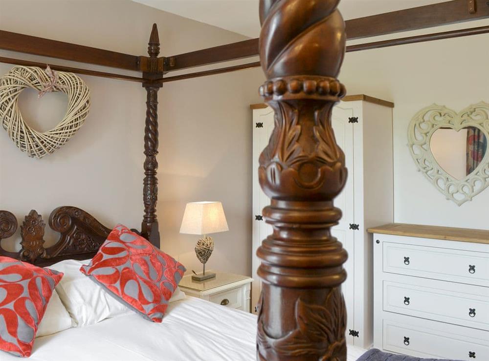 Romantic four poster bedroom at The Coach House in Whittingham near Alnwick, Northumberland, England