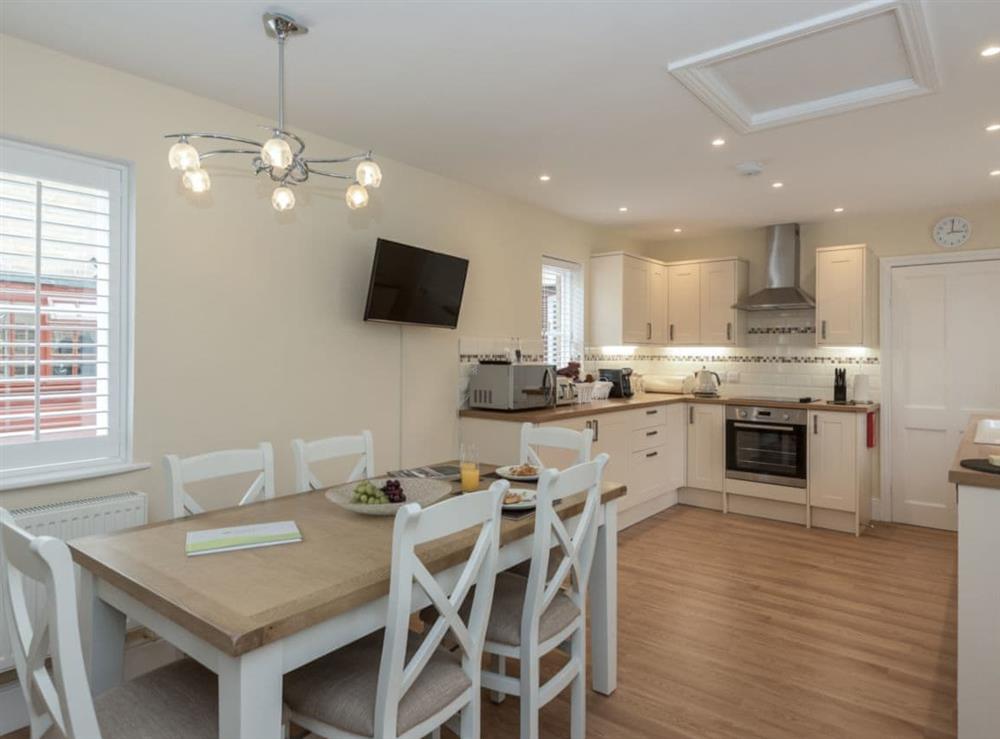 Kitchen with dining area at The Coach House in Wootton, near Ryde, Isle of Wight
