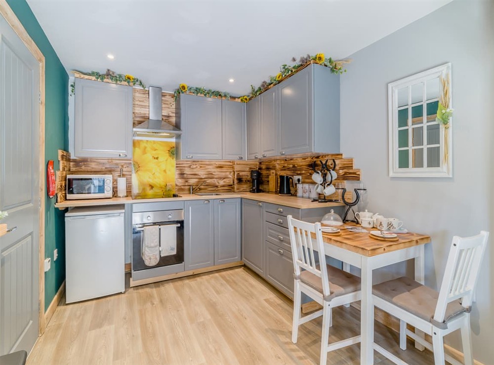 Kitchen/diner at The Coachmans Cottage in Ringwood, New Forest, Hampshire