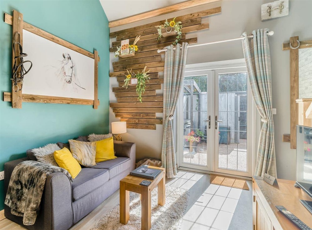 Living area at The Coachmans Cottage in Ringwood, New Forest, Hampshire