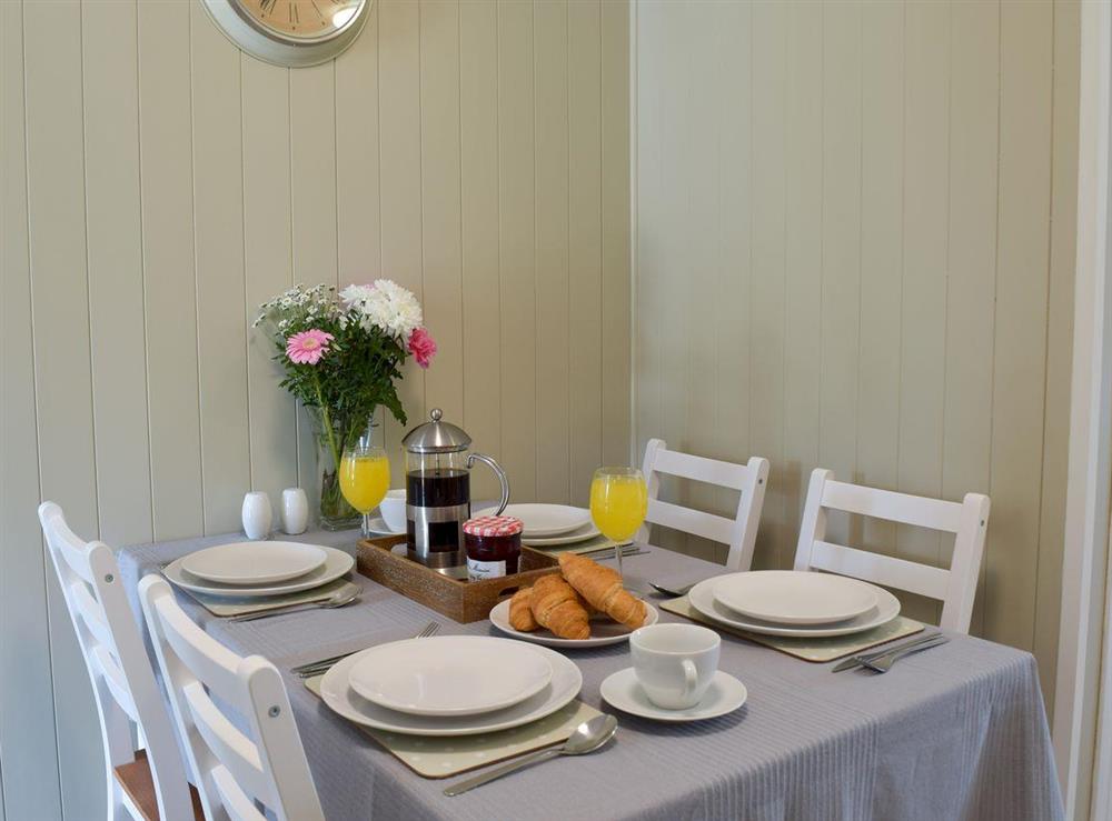 Dining area at The Coastal Cottage in Kessingland, Suffolk, England