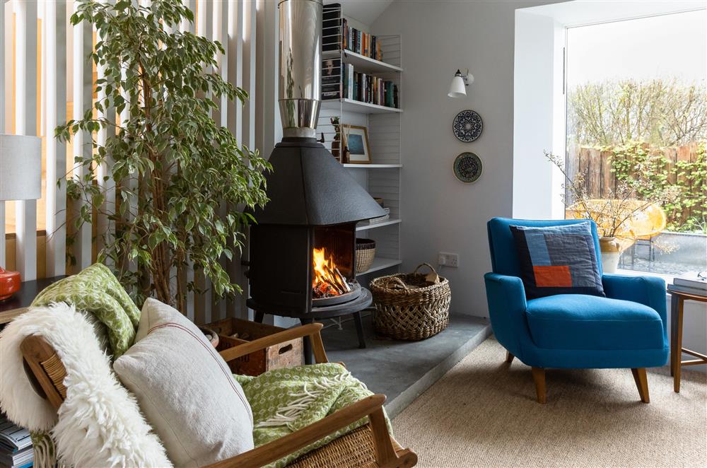 Cosy up by the wood burning stove during the cooler evenings